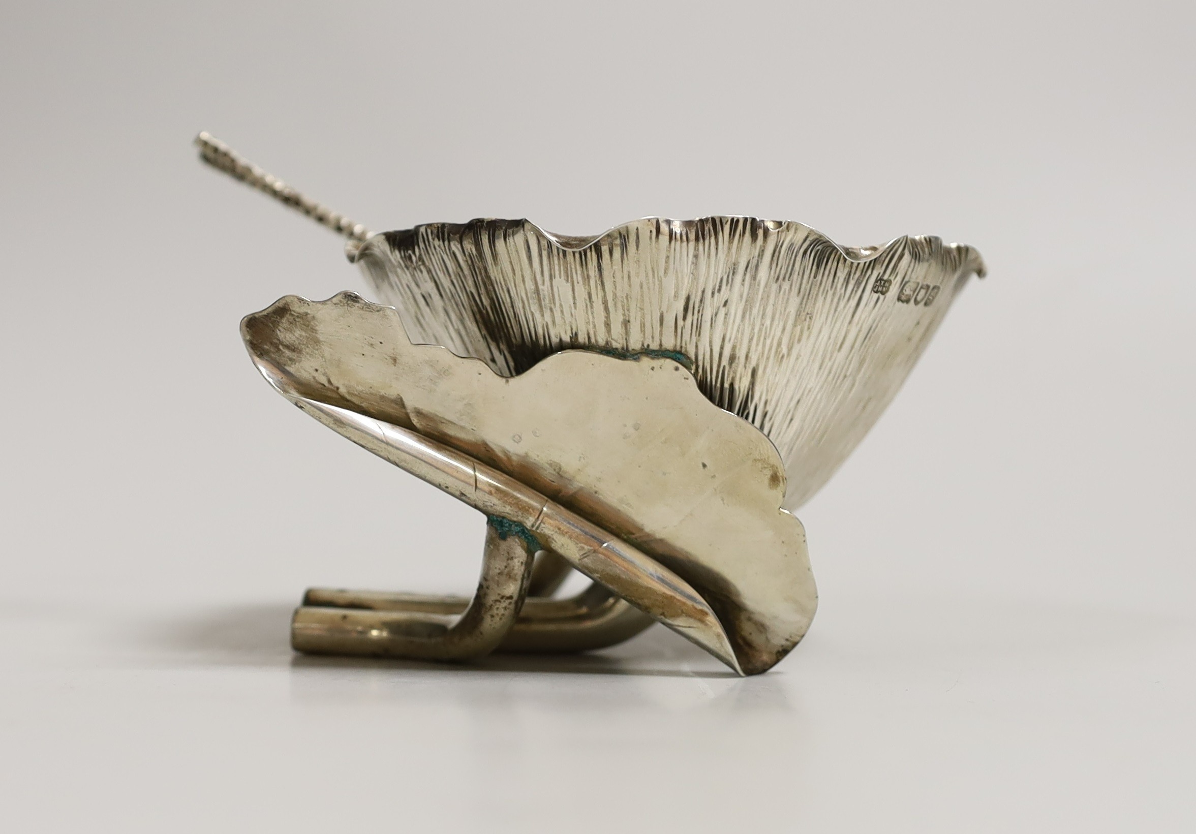 An Edwardian silver lotus shaped sugar bowl and matching sugar sifting spoon, by Hukin & Heath, London, 1902, bowl diameter 11.8cm, 7.5oz.